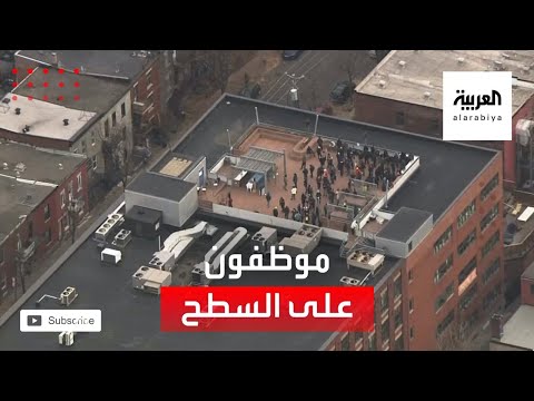 صور لموظفين محتجزين على سطح المبنى الذي يتم فيه احتجاز رهائن في كندا