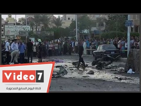 شاهد أثار انفجار سيارتين خلف قسم ثان أكتوبر ورجال المفرقعات يمشطون المنطقة